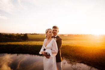 Bride and Groom embrace during sunset photos at Hunter Valley wedding venue Wallalong House