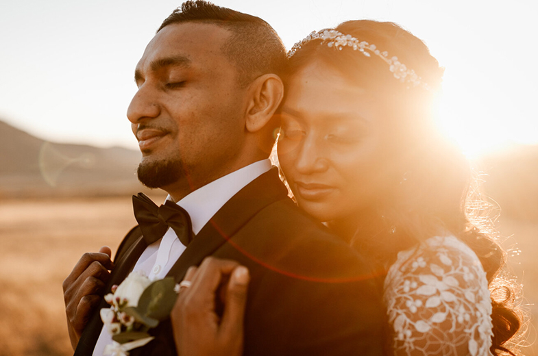 Bride and Groom embrace during photo session in the Hunter Valley at sunset